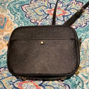 Black crossbody bag that’s only been used once. The condition is new